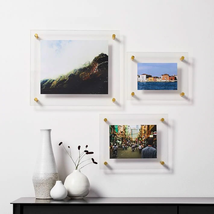 three picture frames on the wall